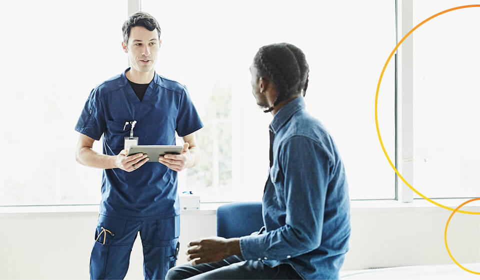 Healthcare professional giving information to patient